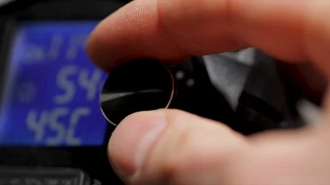 Video light dial being turned up to 100 percent. Turning on LED floodlights in a Stock Footage 123040307