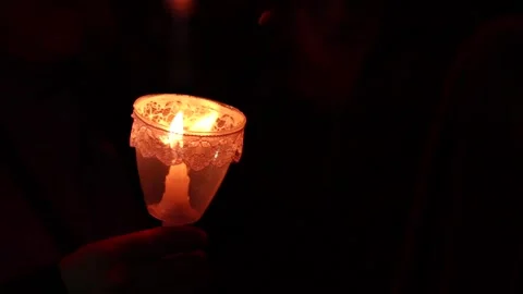 Video of lighted candles in a pilgrimage of a religious festival Stock Footage 232399574