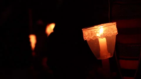 Video of lighted candles in a pilgrimage of a religious festival Stock Footage 232399603