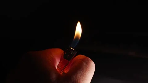 Video of lighting a lighter in the dark Stock Footage 221459195