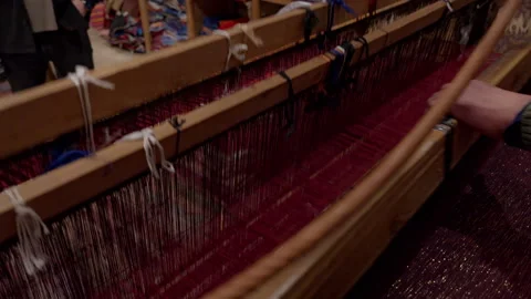 A video of a local master carpet weaver working on a historic carpet-weaving Stock Footage 346433865