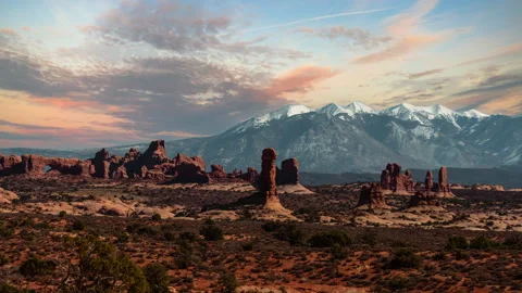 Video loop sunset time lapse of colorful clouds at Arches National Park with Stock Footage 348238867