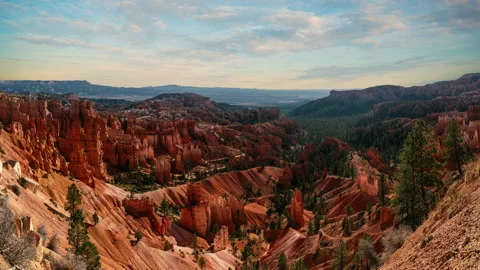 Video loop time lapse of clouds moving over the sky. Red rock hoodoos in Bryce Stock Footage 346131849