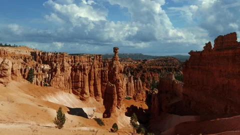 Video loop time lapse of clouds moving over the sky. Red rock hoodoos in Bryce Stock Footage 346131898