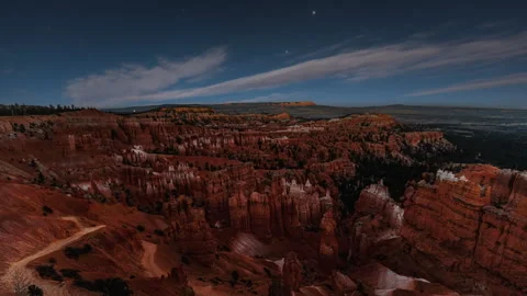 Video loop time lapse of clouds moving over the sky. Red rock hoodoos in Bryce Stock Footage 346131954