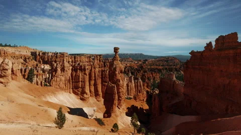 Video loop time lapse of clouds moving over the sky. Red rock hoodoos in Bryce Stock Footage 346132041