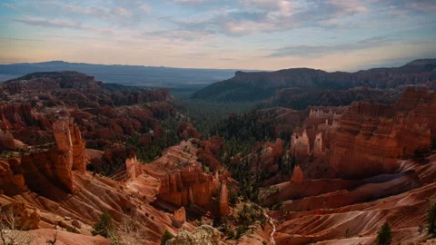 Video loop time lapse of clouds moving over the sky. Red rock hoodoos in Bryce Stock Footage 346132177