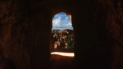 Video loop time lapse of clouds moving over the sky. Red rock hoodoos in Bryce Stock Footage 348119621