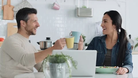 Video of lovely couple using their laptop to searching voyage while toastin.. Video stock 227887889