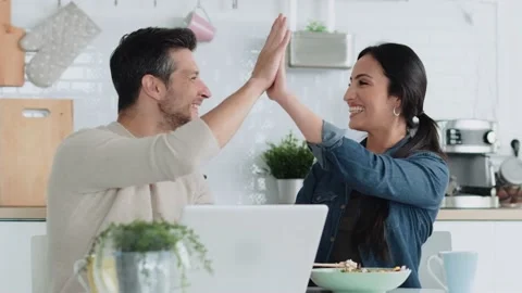 Video of lovely couple using their laptop to searching voyage while eating .. Video stock 227887908