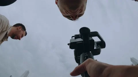The video maker works on a steadicam Stock Footage 199319741