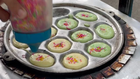 Video making kue cubit (mini pancake) with colorful sprinkles topping Stock Footage 322597832