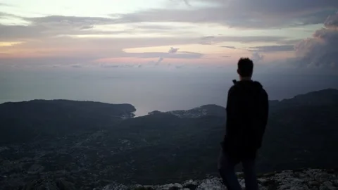 Video of a man enjoying Soller views from the top of a mountain Video stock 140188089