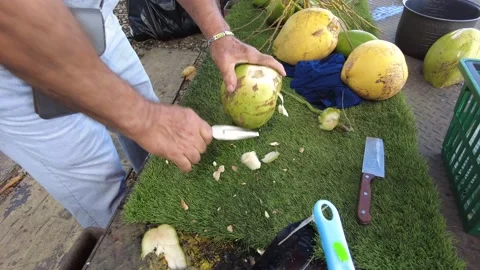 Video of man extracting coconut water Stock Footage 223962017