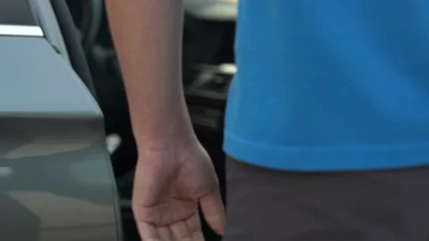 Video of man opens the car door and sits, and goes out Stock Footage 211176143