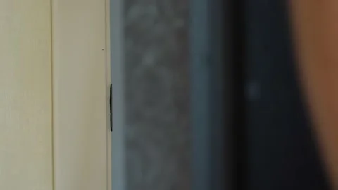 Video of man opens the door and enter in (out) Video stock 211175962