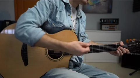 Video of a man playing guitar Video stock 217424776