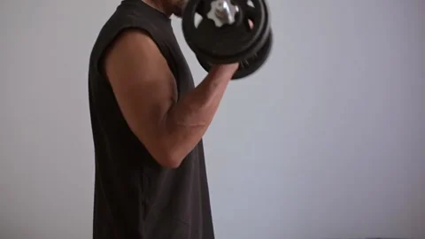 Video of man in profile working right bicep. Copy space Stock Footage 307459542
