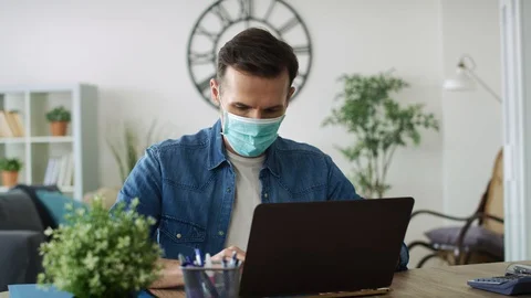 Video of man on quarantine working at home. Video stock 128577832