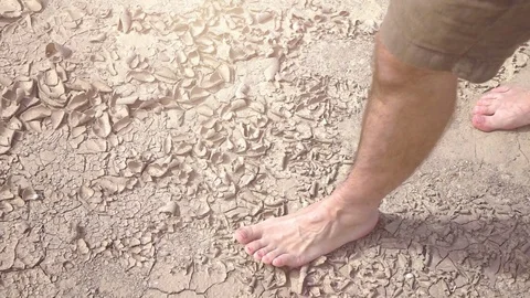 Video of man walking on the desert in real slow motion Stock Footage 80598330