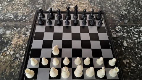 Video of a man's hand demonstrating a chess opening move. Stock Footage 255661212