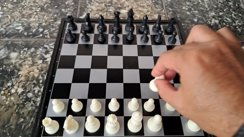 Video of a man's hand demonstrating a chess opening move. Stock Footage 255661214