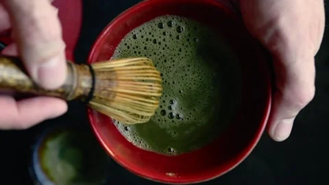 Video of matcha green tea preparation. The process of blending green tea wi.. Video stock 287297541