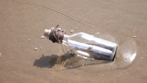 Video of message in the bottle on the beach in real slow motion Stock Footage 78634537