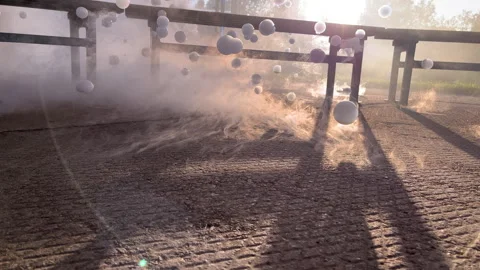 Video Mix of Floating Soap Bubbles Through Smoke in Sunlight Stock Footage 312205718