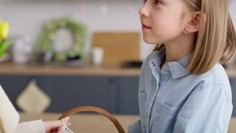 Video of mom applying on a protective mask for daughter. Video stock 148527358