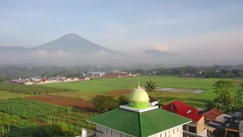 Video of a mosque with a mountain background with drone Stock Footage 292843927
