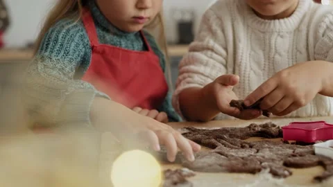 Video of mother helping children with cookie baking Stock Footage 141428811