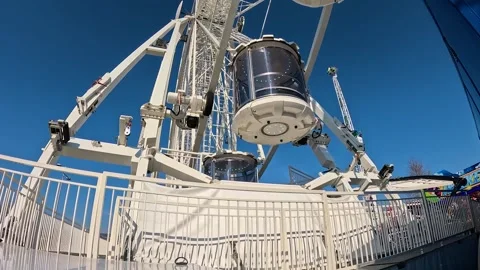 Video of moving gondolas from a ferris wheel. Видео 332800562
