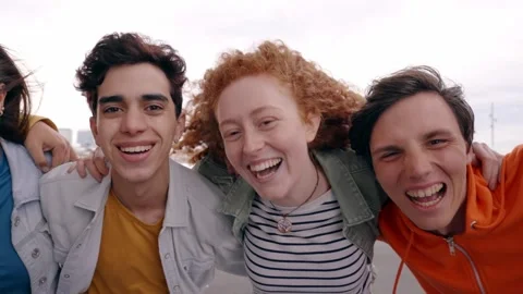 Video of multiracial group of friends smiling carefree outdoors. Friendship Stock Footage 241260237