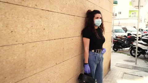 Video of the new normal after COVID 19 coronavirus isolation: a girl wearing  스톡 동영상 130853014