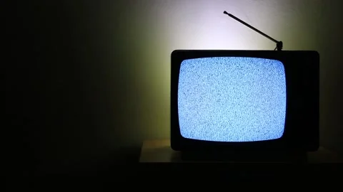 Video of an old television in right side on dark background with no signal Stock Footage 150881947