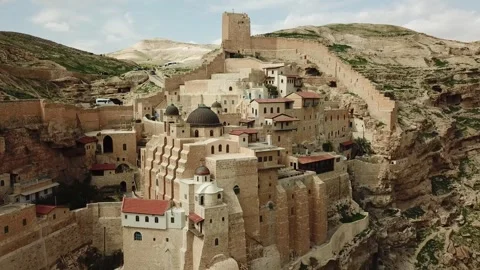 A video of an old town located on a cliff in Judea Desert Stock Footage 303826387