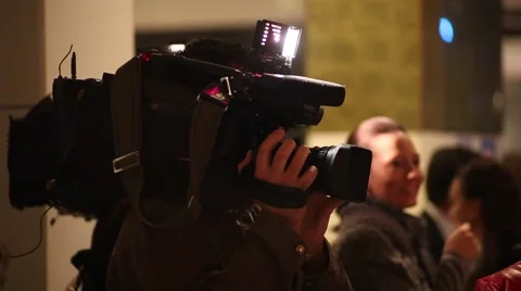 Video operator exposes light on the interviewer Stock Footage 62196351