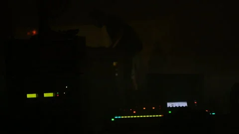 Video operator shooting DJ set concert at night silhouette scene videographer Stock Footage 111839789
