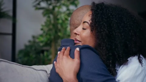 Video of oving cute couple hugging on the couch at home Stock Footage 328186847