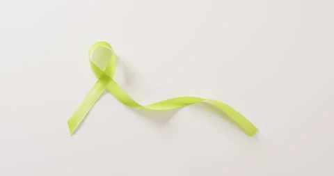 Video of pale green std awareness ribbon on white background with copy space Stock Footage 331207989