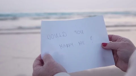 Video of paper with the message in hands in real slow motion Stock Footage 80659765