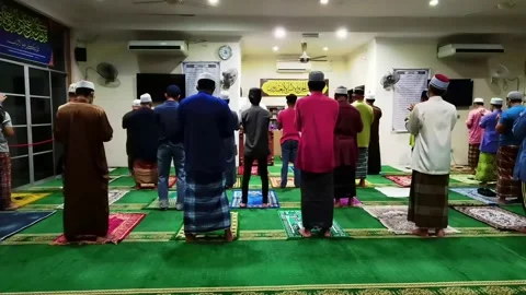 Video People performing prayer and follow Health SOP in the Mosque Stock Footage 148312112