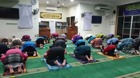 Video People performing prayer and follow Health SOP in the Mosque Stock Footage 148404512
