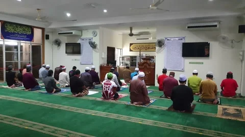 Video People performing prayer and follow Health SOP in the Mosque Stock Footage 148404527