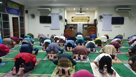 Video People performing prayer and follow Health SOP in the Mosque Stock Footage 148404558