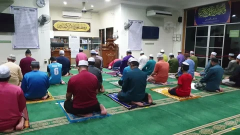Video People performing prayer and maintain social distance in the Mosque Stock Footage 148404606