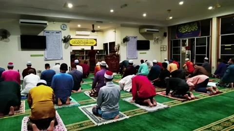 Video People performing prayer in the Mosque and maintain Social Distance Stock Footage 148311211