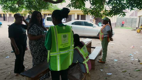 Video of people voting during election in a poling unit and dropping the vote Stock Footage 331424215