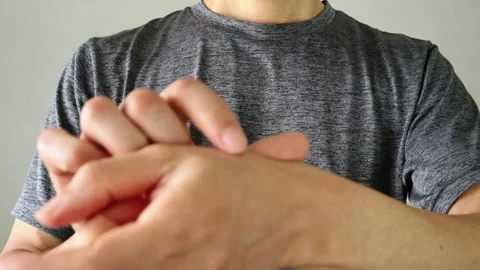 Video of a person applying a compress to their body Stock Footage 324541560